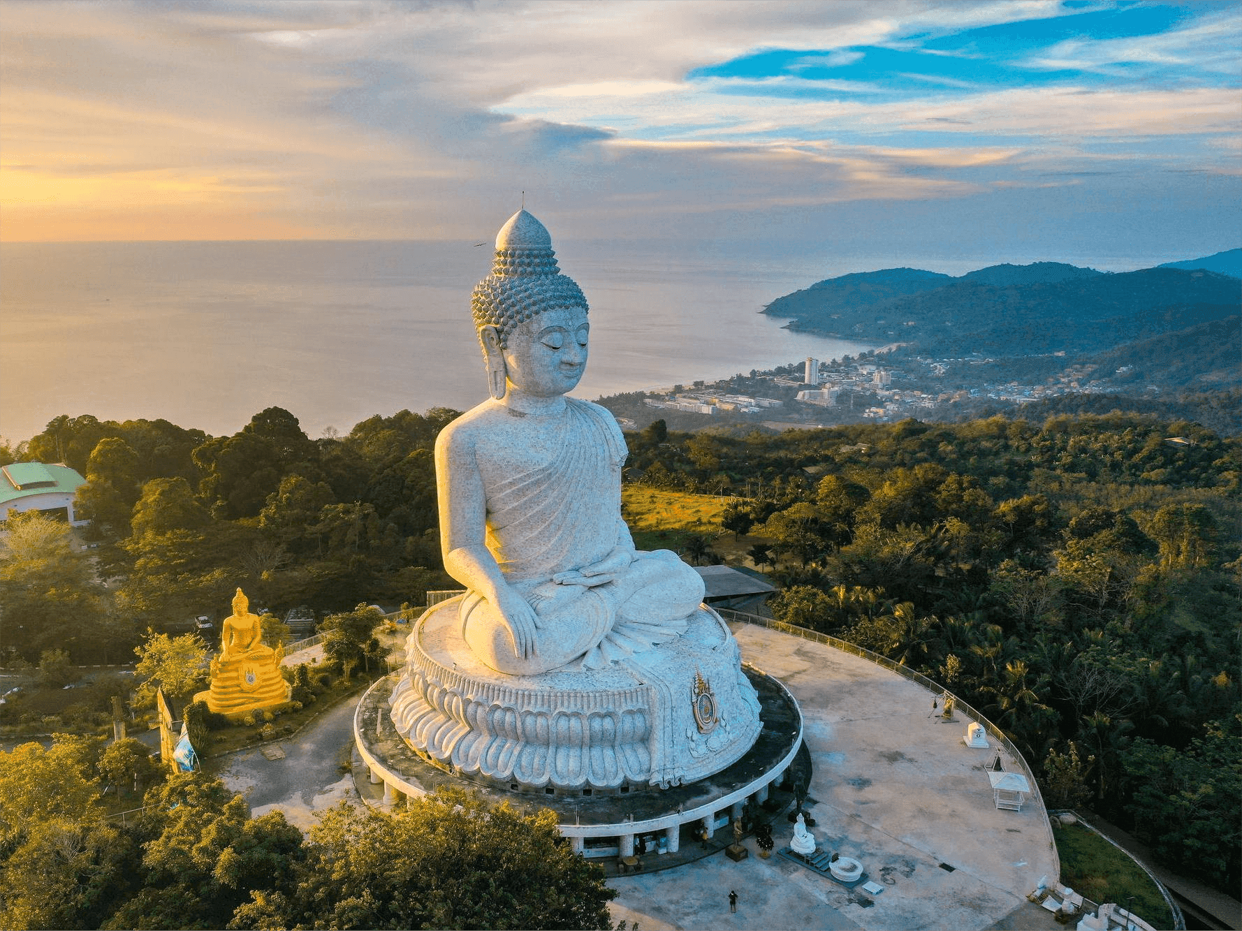 The Big Buddha statue in Phuket, Thailand at sunset, with buildings and the sea in the background
https://www.freepik.com/premium-photo/aerial-view-big-buddha-viewpoint-sunset-phuket-province-thailand_23203091.htm#fromView=search&page=1&position=41&uuid=1ecbca65-fae5-43cf-b9b4-5279d6b1ec42
