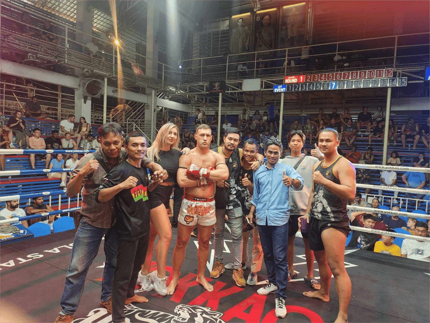 A group of people stand around Muay Thai fighter Barend Rachaimuaythai in the ring of the Bangla Boxing Stadium in Phuket, Thailand
https://www.nowmuaythai.com/gym/rcrachai-muay-thai#gallery-9