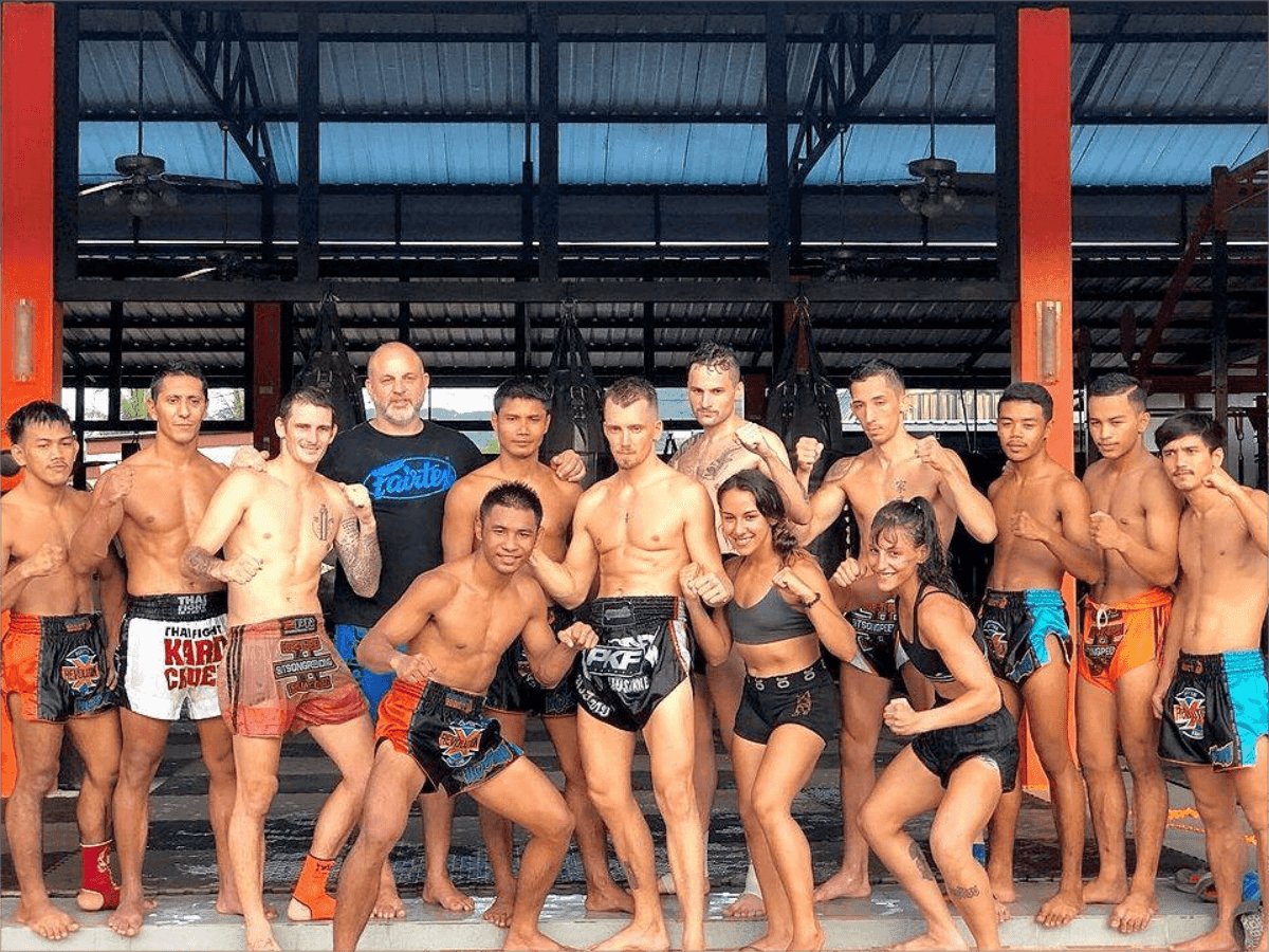 A group of members of the Revolution Muay Thai Gym in Phuket pose
https://www.nowmuaythai.com/gym/revolution-phuket#gallery-2